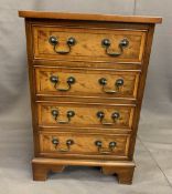 REPRODUCTION YEW WOOD FOUR DRAWER CHEST, neatly proportioned with swan neck handles and cross-banded