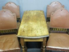OAK DROP LEAF TABLE on turned supports with four rexine and studded dining chairs
