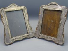 CHESTER 1913/1914 PAIR OF SHAPED SILVER PICTURE FRAMES, 20cms tall (A/F)