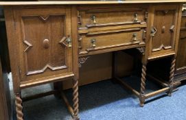 JACOBEAN STYLE RAILBACK SIDEBOARD, the panelled rail with arched carved detail over a base of two