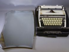 ADLER CASED VINTAGE TYPEWRITER and a bevelled shaped wall mirror