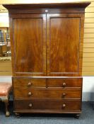 GEORGE IV MAHOGANY LINEN PRESS, angled cornice above reel moulded panelled doors, two short and