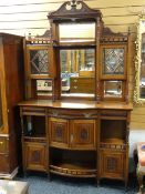 LATE VICTORIAN WALNUT PARLOUR CABINET with glazed and mirrored superstructure, above bow front base,