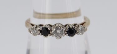 9CT GOLD FIVE STONE DIAMOND & SAPPHIRE RING, the three diamonds totalling 0.18cts approximately (