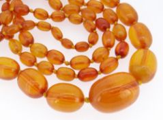 LONG STRING OF GRADUATED AMBER BEADS, from 30mm to 10mm, overall 130cm long, gross weight 98gms