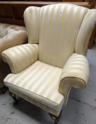 REPRODUCTION GEORGIAN-STYLE WINGBACK ARMCHAIR, upholstered ivory striped material