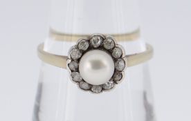 18CT GOLD PEARL & DIAMOND CLUSTER RING, the central pearl surrounded by twelve diamonds, ring size Q