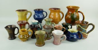 ASSORTED EWENNY JUGS, the larger generally incised in Welsh, some smaller jugs with slip