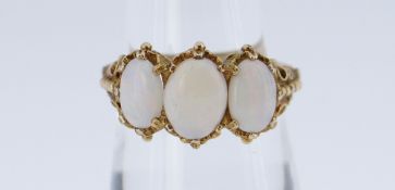 9CT GOLD THREE STONE OPAL RING of graduated design, size N, 3.9gms in box