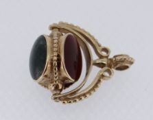 9CT GOLD & HARDSTONE SWIVEL FOB, Sheffield 1983, the beaded arched frame and swivel set with three