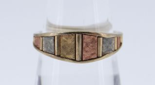 9CT TRI GOLD RING of geometric panel design, size N / O, 2.5gms in box