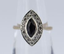 9CT GOLD SAPPHIRE & DIAMOND CLUSTER RING of marquise shape, the central sapphire surrounded by