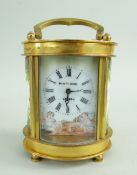 SMALL GILT BRASS & ENAMEL BOUDOIR CARRIAGE TIMEPIECE BY ELLIOTT & SONS, decorated with Cupid by