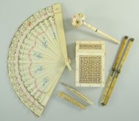 SMALL GROUP OF ANTIQUE IVORY ITEMS including Indian pierced filigree card case, a fan, propelling