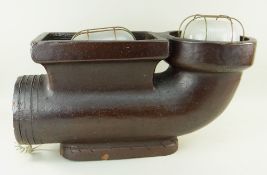 UNUSUAL UPLIGHTER OR LAMP, glazed stoneware drainpipe base loosely fitted with two outdoor lamps,