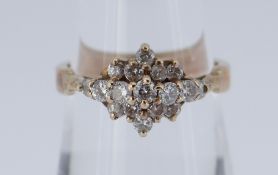 YELLOW METAL DIAMOND CLUSTER RING, the five row design consisting of seventeen diamonds, size N, 3.