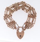 9CT GOLD GATE BRACELET having heart shaped padlock, 21.4gms