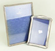 TWO SILVER PHOTOGRAPH FRAMES, one large and one medium both of easel design (2)