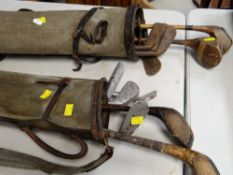 TWO VINTAGE GOLF BAGS containing assortment of woods and irons