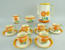 STYLISH 1930s ART DECO COFFEE SERVICE FOR SIX, boldly painted with flowers in orange, green,