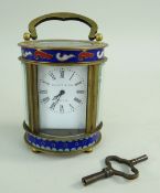 SMALL GILT BRASS & ENAMEL BOUDOIR CARRIAGE TIMEPIECE BY ELLIOTT & SONS decorated with champleve