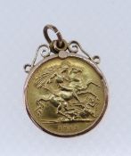 GEORGE V HALF SOVEREIGN, 1912, in 9ct gold scroll design mount, 4.9gms