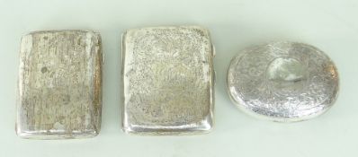 TWO SIMILAR SILVER ENGRAVED CIGARETTE CASES (BIRMINGHAM HALLMARKS) ONE CONTAINING CHEROOT HOLDER
