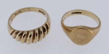 TWO 9CT GOLD RINGS comprising a ridged example and a signet ring, sizes M and I / J, 9.2gms