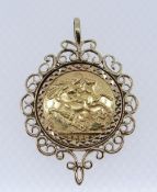 EDWARD VII GOLD SOVEREIGN, 1907, in 9ct gold scroll design mount, 12.7gms