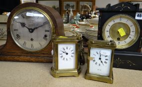 FOUR CLOCKS including a Belgian slate mantel clock, oak mantel clock retailed by J W Benson and