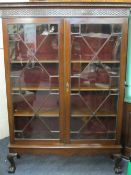 EDWARDIAN DISPLAY CABINET with twin astragal glazed doors on ball and claw feet, 186cms H, 132cms W,