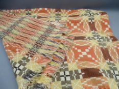 WELSH WOOLLEN BLANKET IN THE TRADITIONAL STYLE, Terracotta and contrasting colours with tasselled
