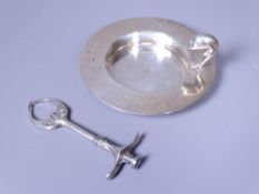 ARTS & CRAFTS SUGAR TONGS and a modern circular dish with dolphin handle, Chester 1906, Maker W J