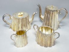 VICTORIAN FOUR PIECE RIBBED EPNS TEASET with bright cut decoration