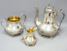 VICTORIAN THREE PIECE EPBM GLOBULAR TEASET with decoration in relief and gilt lined jug and sugar