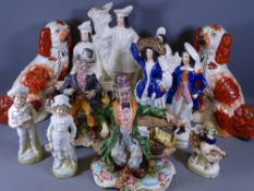 STAFFORDSHIRE & CAPODIMONTE FIGURINES with a pair of red decorated seated spaniels, 31cms H