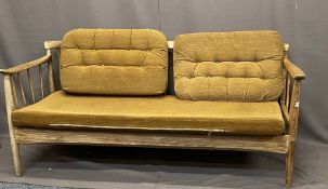 DANISH STYLE TEAK SPINDLE BACK SETTEE with unusual lift and drop-down arm, 68cms H, 166cms W,