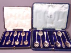 CASED SILVER TEASPOONS, two sets including a large set of six with sugar tongs by Walker & Hall