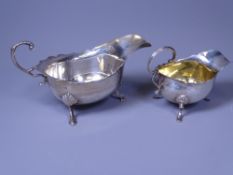 THREE FOOTED CREAM JUG & SIMILAR STYLE GRAVY BOAT, Chester 1898, makers George Nathan and Ridley