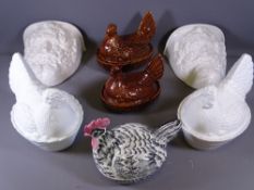 TWO PRESSED GLASS & THREE POTTERY 'HEN ON NESTS' with two modern wall pockets having face mask
