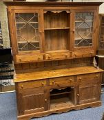 REPRODUCTION PINE GLASS TOP DRESSER having twin astragal glazed doors and central shelving and three