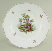 A NANTGARW PORCELAIN PLATE of shaped circular form, decorated in the Chelsea style with a scene of