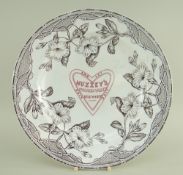 A RARE YNYSMEUDWY POTTERY ADVERTISING DINNER PLATE FOR HUZZEY'S in the Alma transfer of trailing