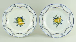 PAIR OF SWANSEA HAYNES, DILLWYN & CO EARTHENWARE PLATES of notched circular form, painted with a