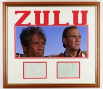 STANLEY BAKER & IVOR EMMANUEL AUTOGRAPHS in pen and on separate sheets, framed with a Zulu