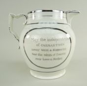 A SWANSEA POTTERY SILVER-LUSTRE COMMEMORATIVE JUG of bellied form with scroll handle, dedicated to