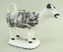 A GLAMORGAN POTTERY COW CREAMER with tail as loop handle, standing on a naturalistic oval base,