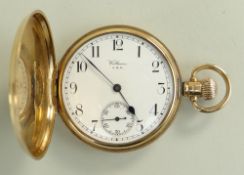 9CT GOLD WALTHAM FULL HUNTER POCKET WATCH having engine turned outer case, revealing enamel face