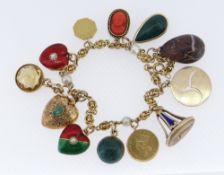 VICTORIAN GOLD CHARM BRACELET having double loop and ball links with seed pearls, holding twelve