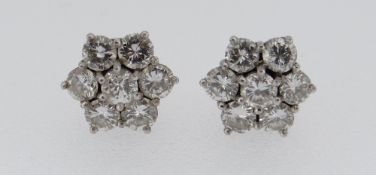 PAIR OF WHITE METAL SEVEN-STONE DIAMOND CLUSTER EARRINGS, each stone 0.07ct approximately (visual